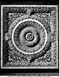Sculpted panel with central rosette and plant elements. The panel is part of the Baptismal Font, work by Guido Bigarelli da Como, located in the Baptistery of Pisa
