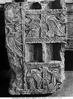 Stone fragment from an architectural element, dating to the Orientalizing Period, sculpted in relief with fantastic animals; in the National Museum of Tarquinia, in Tarquinia