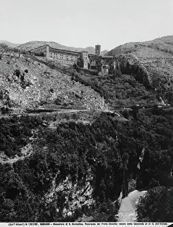 View of the Monastery of Santa Scolastica, near Subiaco. At the bottom in a cavern of the limestone mountains runs the Aniene River