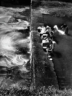 Washing laundry in the river