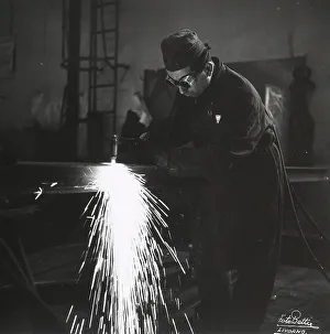 Industrial Worker Prints: A welder using a blow-torch