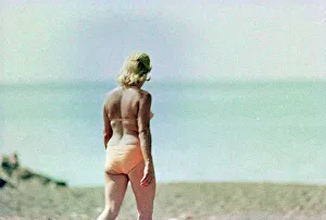 Woman In Swimsuit Prints: Woman in a swimsuit on the beach of Cecina
