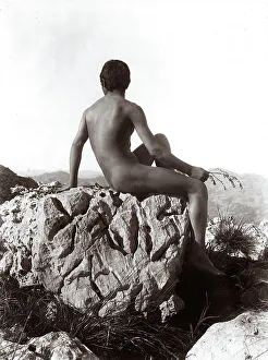 Young Man On Rock Prints: Young man posing on a rock