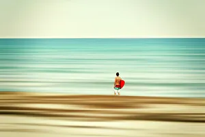Peaceful Ocean Views Prints: Surfer at the beach