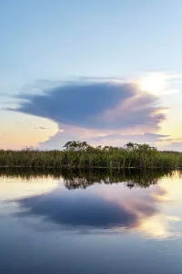 Blue Hour Reflections Prints: Unusual cloud formation exploding over wetlands