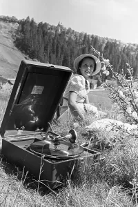 Electrola Print: Young Woman Listening to a Record on a Portable Gramophone