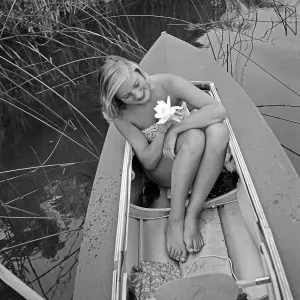 Freizeit Print: Young Woman with Water Lily in Folding Boat, Germany 1930s
