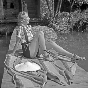 Lake Scene Print: Young Woman Sitting on a Boardwalk