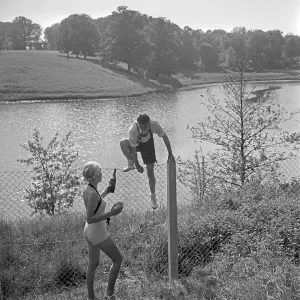 Freizeit Print: A Young Man Climbing a Fence, Germany 1930s