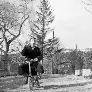 Junger Mann auf Kinderfahrrad Print, 1956