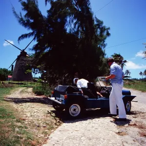 Barbados Tourist in a Beach Buggy near an Old Windmill Print