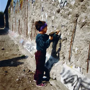 Berlin 1990 Print: A Young Boy Carves the Berlin Wall on the West Side