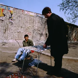 Berlin 1990 Print: A Young Man Selling Berlin Wall Fragments to Tourists
