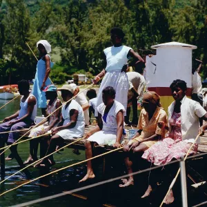 Mauritius Print, a photograph of people fishing on a dock