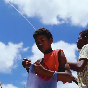 Mauritius Print: Young Man Lost in Thought While Fishing
