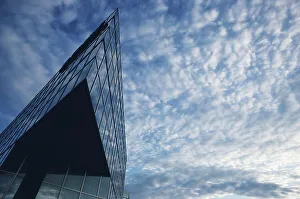 Cloudy Day Cityscape Prints: Architectural detail of a skyscraper against cloudy sky
