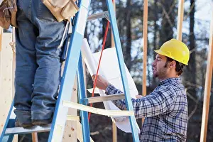 Home Construction Process Prints: Carpenter explaining house plans