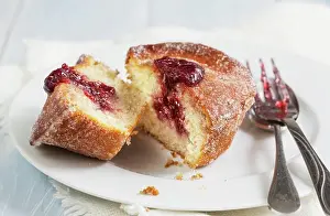 Copy Space Desserts Prints: A doughnut muffin with raspberry jam, sliced