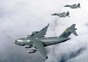 US Air Force Aircraft Prints: Two fighter planes escorting a C-17 Globemaster III, F-15B Eagle, US Air Force