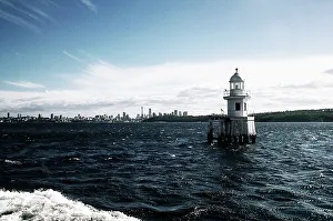 Australia Travel Destinations Prints: Lighthouse with buildings in the background
