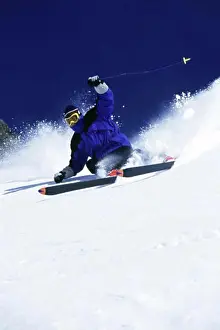 Downhill Skiing Prints: Low angle view of a man skiing