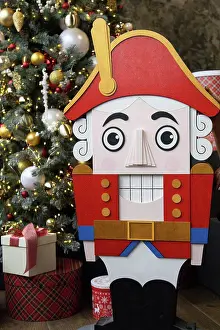 Christmas Tree Decorations Prints: Red nutcracker near the tree