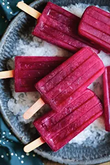 Frozen Food Photography Prints: Red popsicles on ice