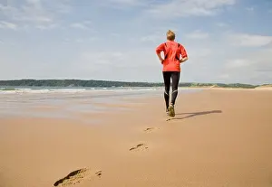 Footprints In Sand Prints: Runner making footprints on beach