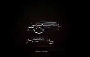Black Background Photography Prints: Typewriter on table against black background