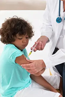Pediatrician Consultation Prints: Vaccinating a boy