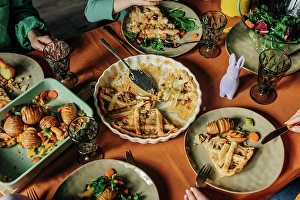 Family Mealtime Moments Prints: Various food kept on dining table at Easter dinner