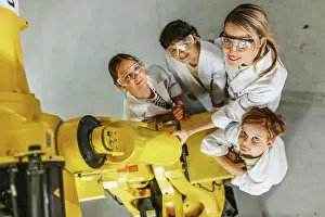 Top view of Elementary school children learning robotics Print