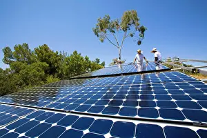 Prints of Workers install a solar array on a hillside in Malibu, Installation by Martifer Solar USA, California, USA April Prints: Solar Array Installation Print