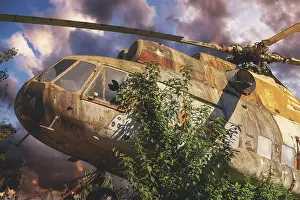 Deserted European Landscape Photos Prints: Abandoned, rusty helicopter surrounded by trees