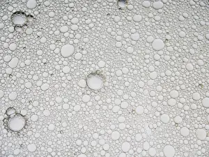 Creative Abstract Art Prints: An abstract pattern featuring numerous bubbles in varying sizes