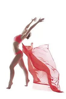 Young Woman Pose Prints: Active slim model posing with pink cloth