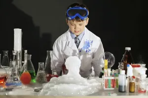 Educational Institution Images Prints: Adorable smart boy doing experiment in studio