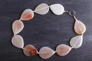 Luxury Handicrafts Prints: Agate colored beads on a black background