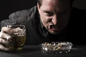 Man Smoking A Cigarette Prints: Aggressive man with beer