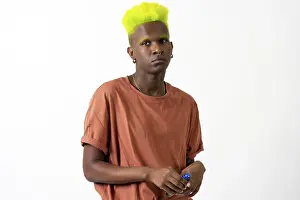 Androgynous Black Man Prints: An androgynous black man posing in a studio on a white background