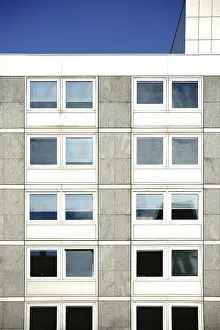 Uninhabited Construction Site Photo Prints: The angular exterior facade of a school building with large windows The angular exterior fa