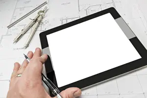 Residential Architecture Prints: Architech working on blank computer tablet
