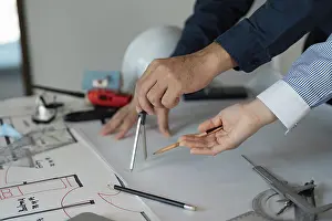 Construction Project Blueprint Prints: Two architects collaborating on design plans