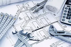 European Construction Project Prints: An architect's construction plan with a calculator