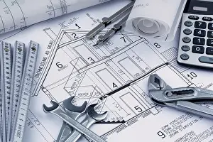Architect Construction Plan Prints: An architect's construction plan with a calculator