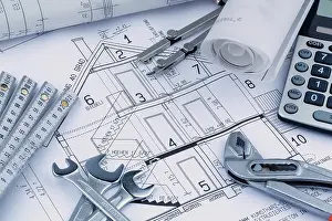European Construction Project Prints: An architect's construction plan with a calculator
