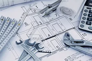 European Construction Project Prints: An architect's construction plan with a calculator