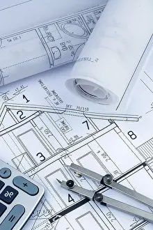 Architect Construction Plan Prints: An architect's construction plan with a calculator