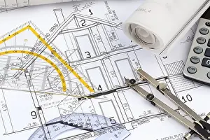 Architect Construction Plan Prints: An architect's construction plan with a calculator