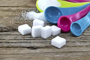 Sugar Cubes Prints: Array of sugar presentations on a wooden table